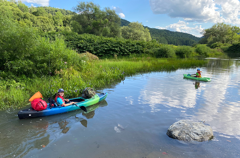 Kayakers enjoy a paddle on Waterbury Reservoir.