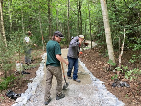 State Lands staff building a universally accessible trail at Aitken State Forest