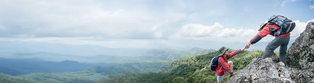 mountain view, two people climbing on rocks